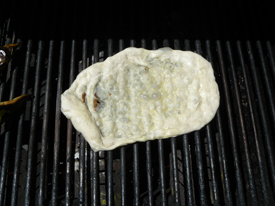Grilled pizza dough puffing up