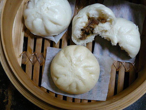 Steamed filled buns (bao) filled with charsiu