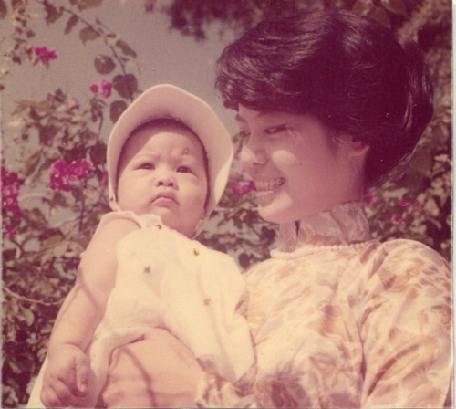 My mom with her first-born, circa 1960.