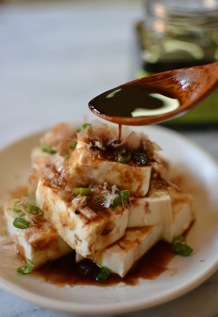 Japanese umami soy concentrate being used on tofu.