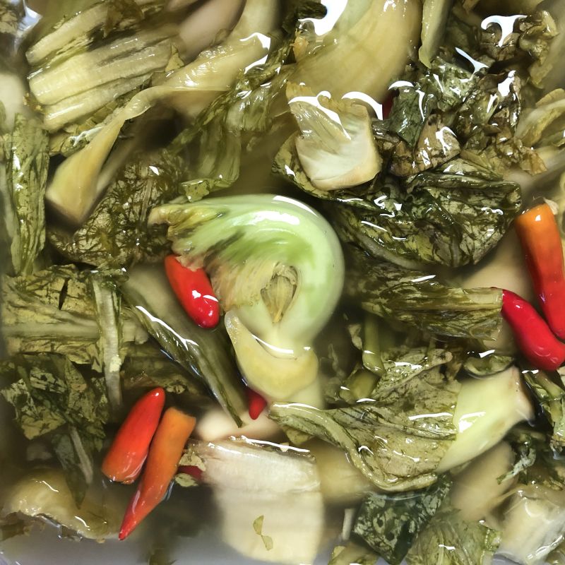 https://www.vietworldkitchen.com/wp-content/uploads/2018/09/fermented-mustard-greens-testing-doneness.jpg