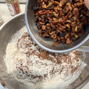 adding the macerated fruit and nuts