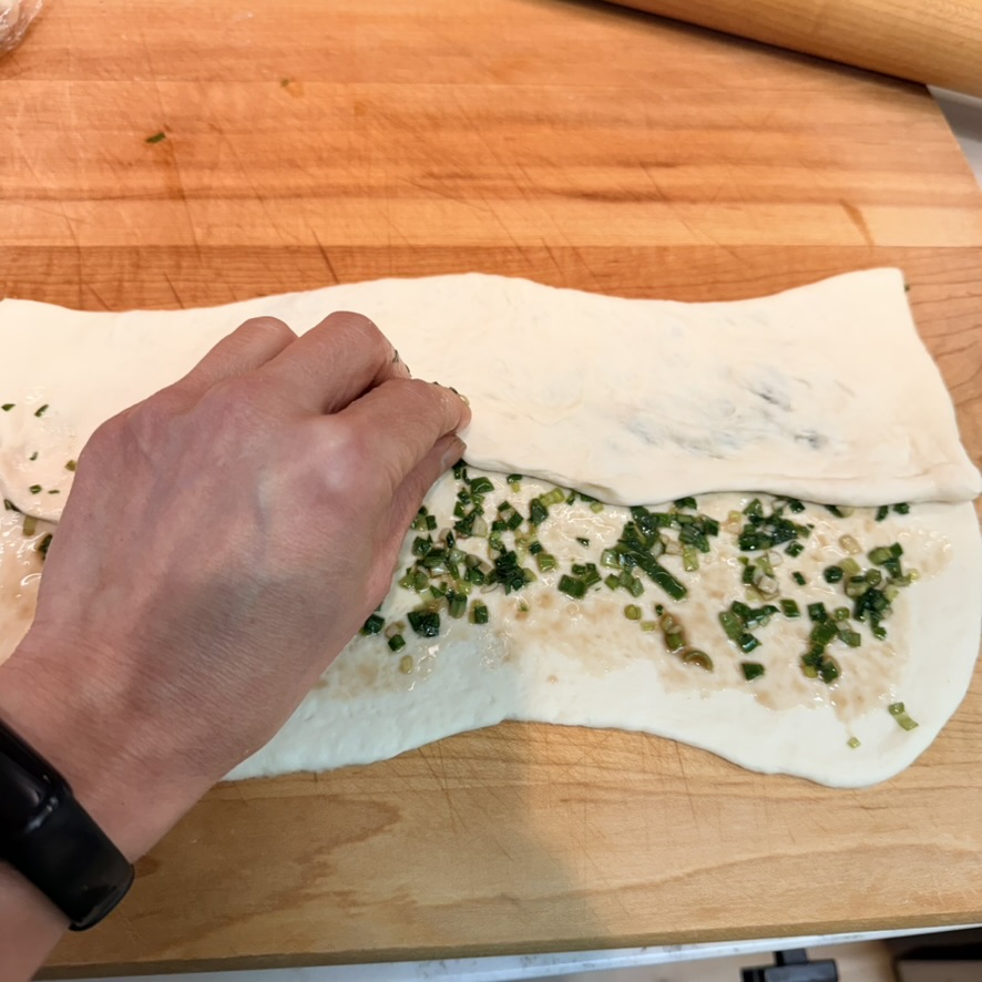 sesame scallion bread trifolding the dough