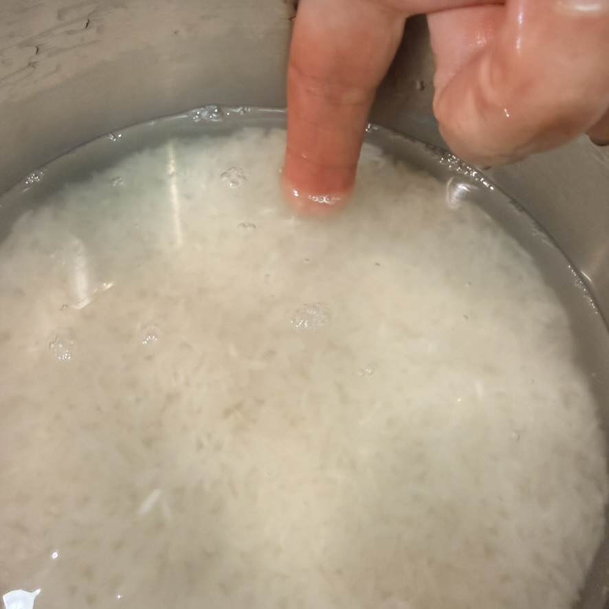 measuring water with finger