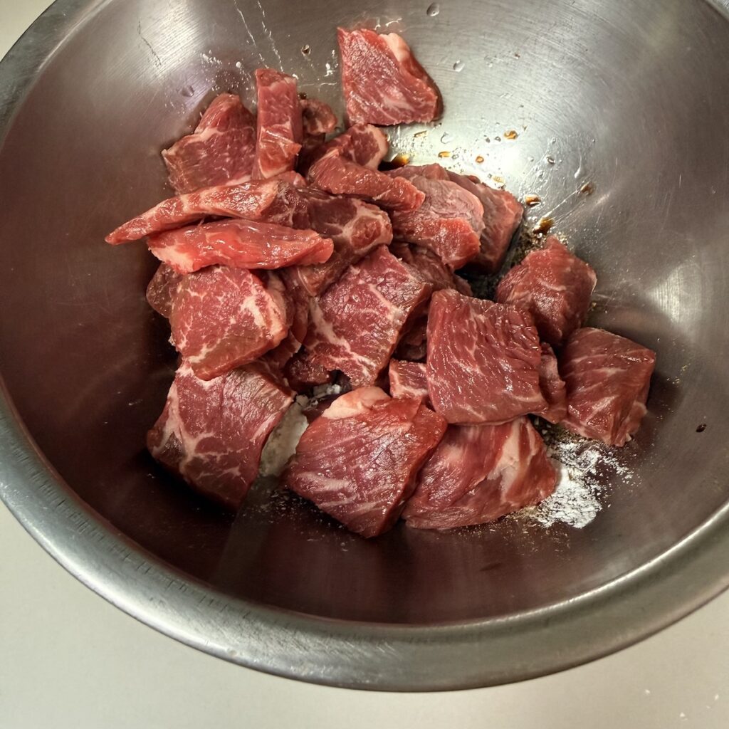 stir-fried beef and collard greens marinating beef